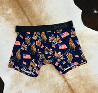 Navy boxer briefs with cowboy and American flag pattern on a fur surface
