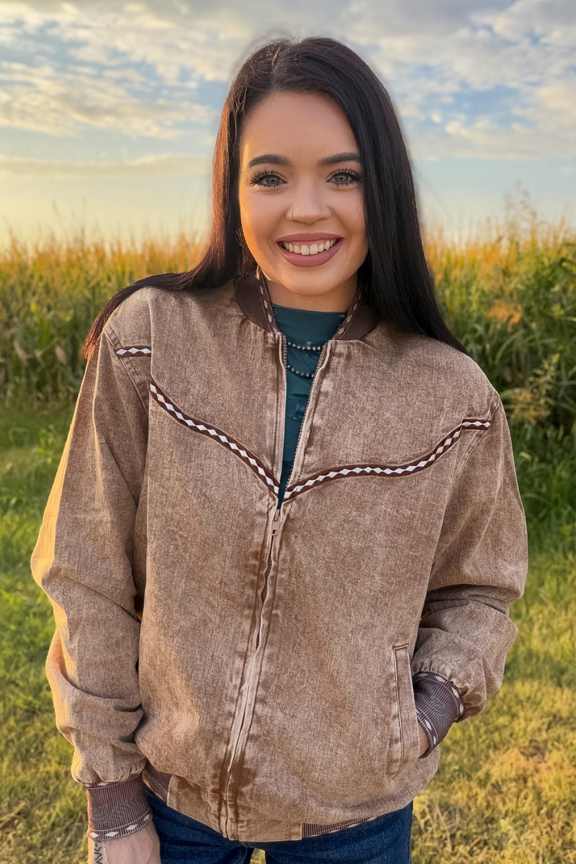 woman outside wearing buckskin bomber jacket 