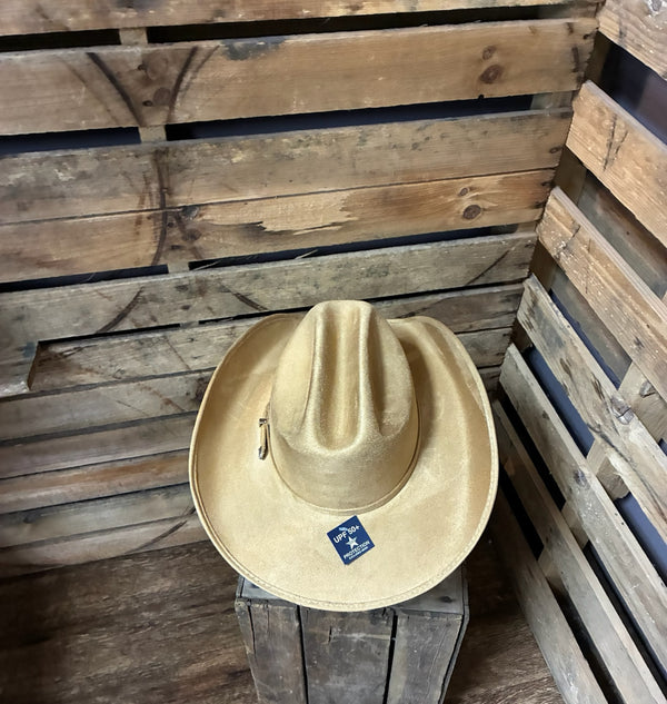 Beige cowboy hat with a brand logo on a wooden surface