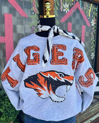 Custom fleece sweatshirt with 'TIGERS' design in orange and black on a gray background.