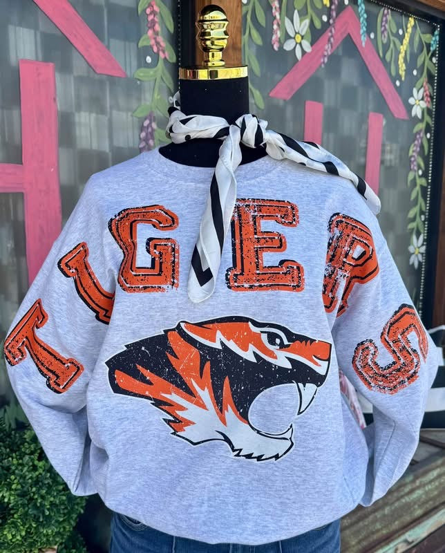 Custom fleece sweatshirt with 'TIGERS' design in orange and black on a gray background.