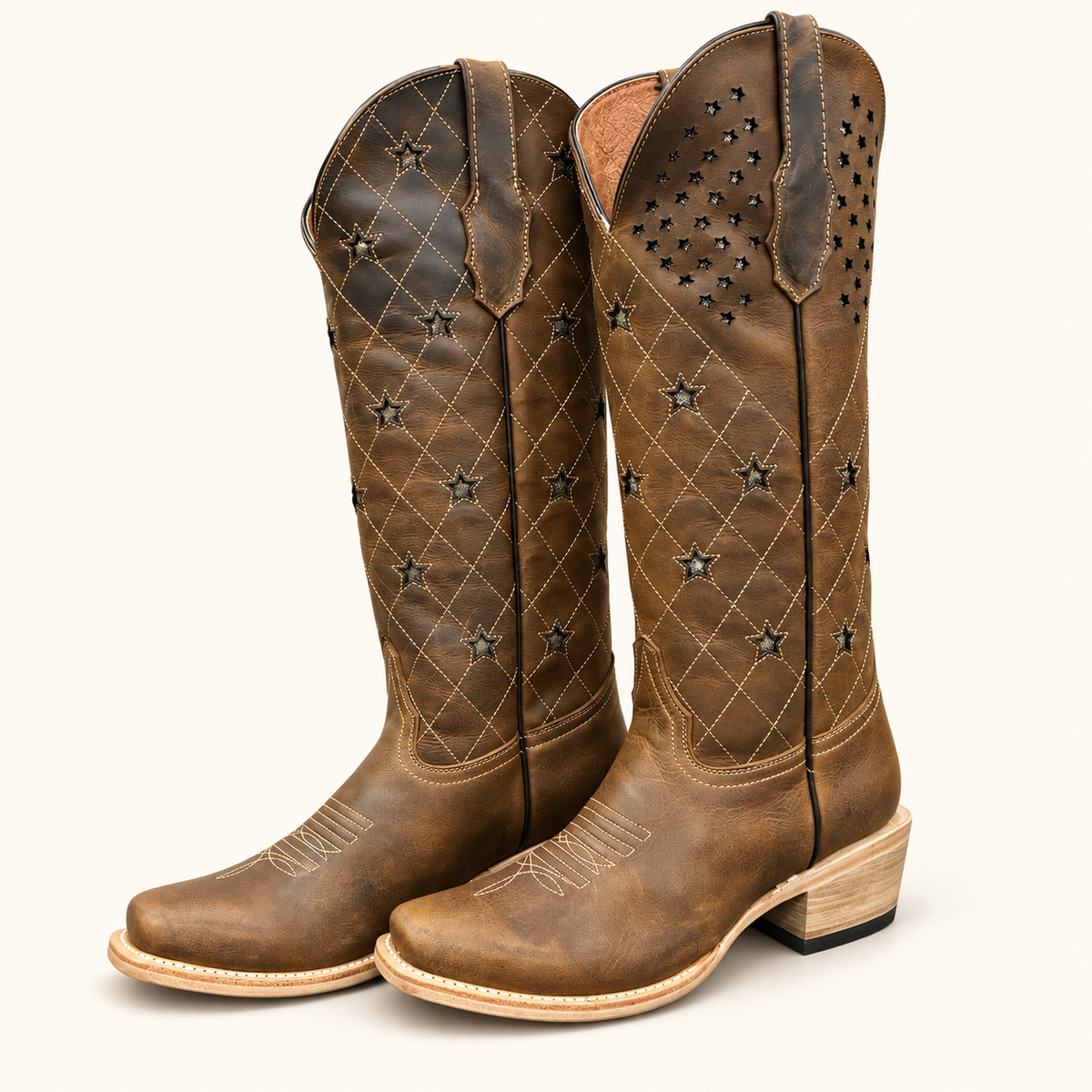 A pair of brown leather knee-high cowboy boots with star-shaped cutouts and diamond-quilted stitching, shown on a clean off-white background.